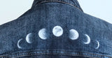 Phases of the moon hand painted above the jacket shoulder seam.